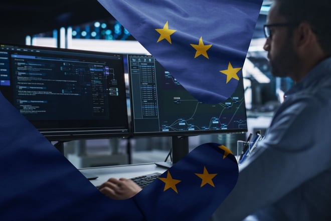 Mann som jobber foran dataskjermer og EU flagg